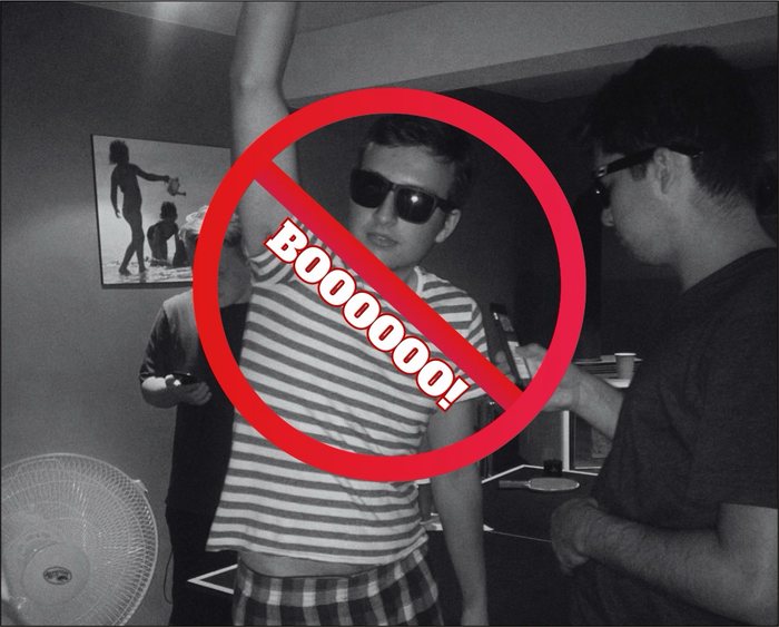 A young Cody F. in sunglasses, struck through with a red BOOOOOO! sign.